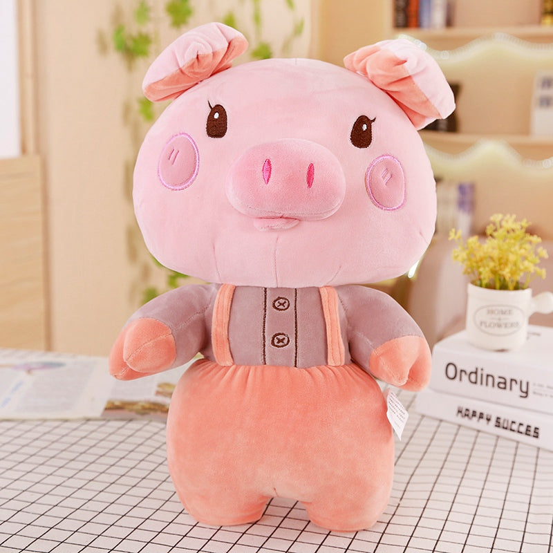 Cuscino maialino di peluche con salopette